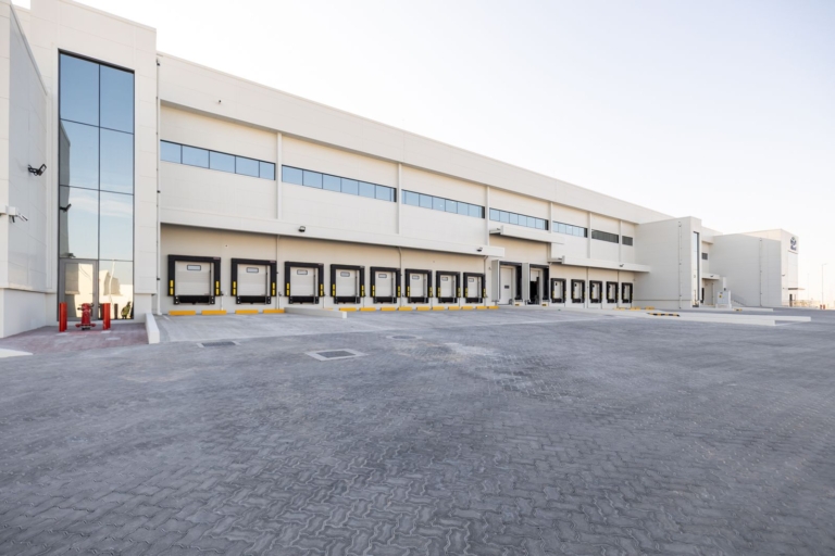 Group AMANA has been awarded the construction of the Almarai Logistics and Office Facility in ICAD 3, Abu Dhabi, a 52,000 sqm development designed to support Almarai's growing logistics and distribution operations. The facility will feature advanced warehousing, cold storage, and office spaces, incorporating pre-engineered steel structures, refrigeration systems, modern fire protection solutions, EV charging stations, and integrated smart building technologies.