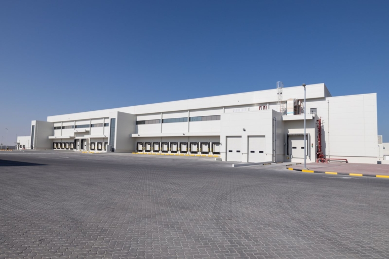 Group AMANA has been awarded the construction of the Almarai Logistics and Office Facility in ICAD 3, Abu Dhabi, a 52,000 sqm development designed to support Almarai's growing logistics and distribution operations. The facility will feature advanced warehousing, cold storage, and office spaces, incorporating pre-engineered steel structures, refrigeration systems, modern fire protection solutions, EV charging stations, and integrated smart building technologies.